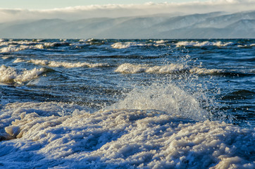 frozen sea view. Waves hitting icy coastline