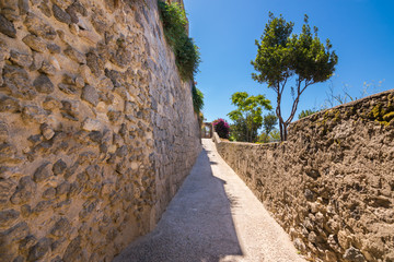 A summer day visiting Aragonese Castle and looking toward Capri and Vesuvi Ischia Ponte, Ischia,...