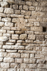 Gubbio, Perugia, Italy -   ancient wall in a small typical street of the Gubbio village.