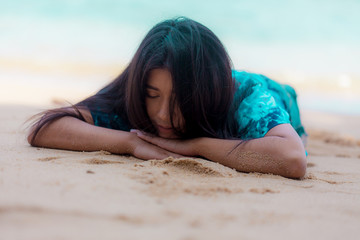portrait sexy asian woman posing sleeping on the beach  for relax 