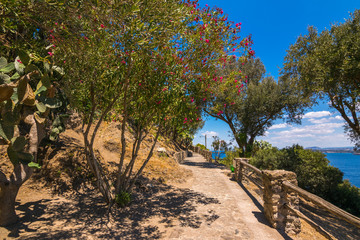 A summer day visiting Aragonese Castle and looking toward Capri and Vesuvi Ischia Ponte, Ischia,...