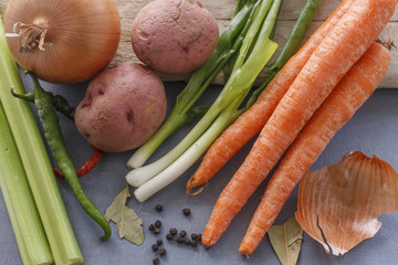 Veggies with peppercorn and bay leaves.