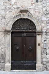 Gubbio, Perugia, Italy -  entrance door, architectural details of the ancient palaces