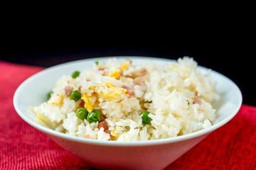 Homemade Chinese fried rice with vegetables and fried eggs