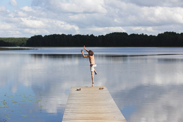 Fototapeta na wymiar old wooden jetty at a lake
