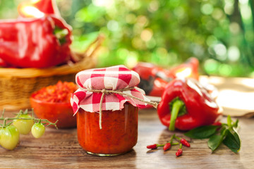 Jar with ajvar on the table