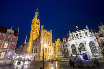 Historic landmarks of the Old City of Gdansk, Poland: the Gothic-Renaissance Town Hall (Ratusz), the Artus Court (Dwor Artusa) and the Fountain of Neptune