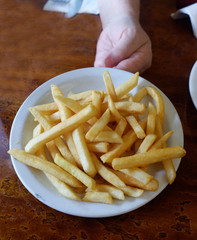 Plate of hot diner French fries.
