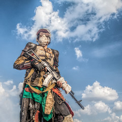 Post apocalyptic survivor creature with homemade weapons