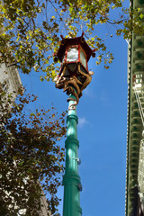 Fototapeta na wymiar Chinatown lamppost against blue sky.