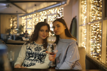 The girl in the evening rest in a cafe 