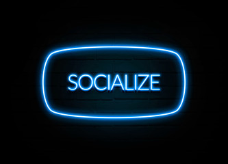 Socialize  - colorful Neon Sign on brickwall