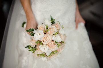 Bride in white dress holding a bouquet