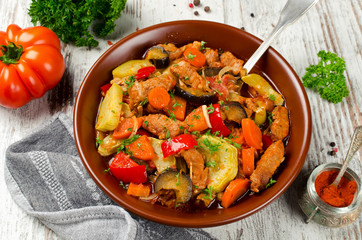 Meat stew with with eggplant, carrots, onions, peppers and zucchini