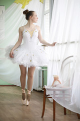 Fototapeta na wymiar Pretty girl ballet dancer practicing
