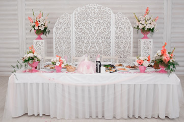 Decorated in white and pink tones wedding buffet table