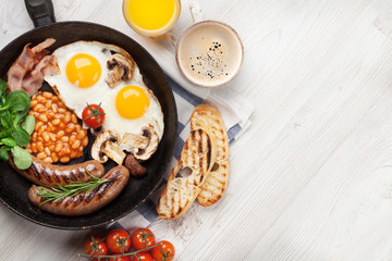 English breakfast. Fried eggs, sausages, bacon