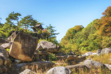 Fototapeta premium Small ancient tea house in Nezame-no-toko Gorge in autumn. Agematsu, Kiso District, Nagano Prefecture, Japan. 