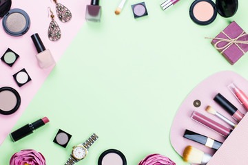 Woman make up products and accessories on pastel background