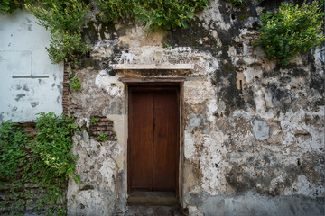 Fototapeta na wymiar Old house with a wooden door.
