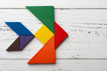 wooden tangram in a swallow shape