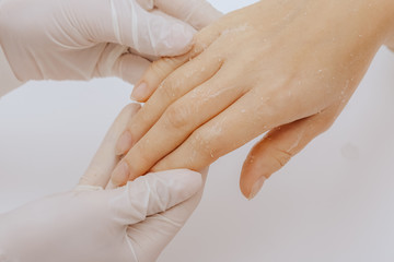 Application of cream on female hands