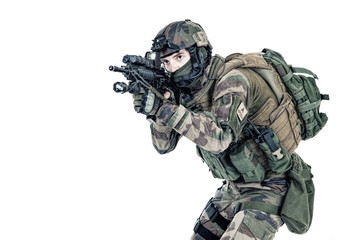 Paratrooper of french 1st Marine Infantry Parachute Regiment RPIMA studio shot firing pointing...