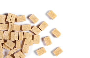 Brown cane sugar cubes isolated on white background, top view