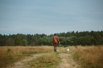 Owner with dogs on field