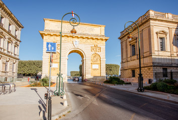 Street view with famous Triumphal Arch on the Foch boulevard during the morning light in Montpellier city in Occitanie region of France