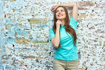 Girl portrait against brick wall background.