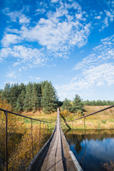 Bridge over the river and the autumn nature around