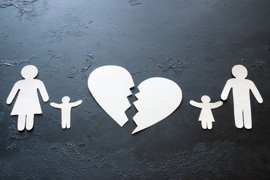 paper family and a broken heart concept divorce