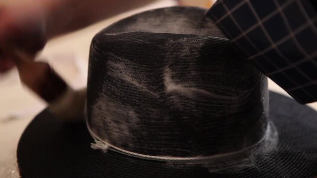 Hat-maker in works