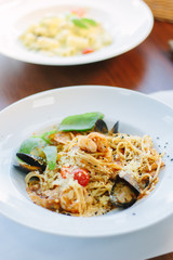 Italian food - spaghetti pasta with seafood - mussels and shrimps.