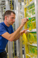 Telecommunication technician in server room