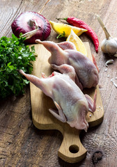 Raw uncooked quail meat