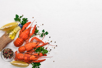 Lobster. Seafood. On a wooden background. Top view. Free space for your text.