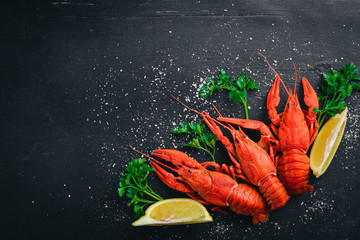 Lobster. Seafood. On a wooden background. Top view. Free space for your text.