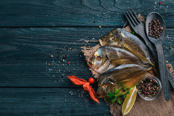 Seafood. Fish Vomer, lobster, salmon. On a wooden background. Top view. Free space for text.