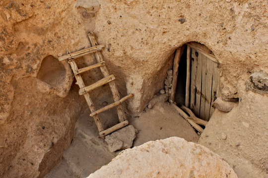 Entrance door to one of buildings in rock in Kandovan town in Iran.