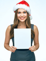 Smiling Santa girl business woman holding white blank advertising banner.