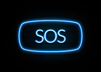 Sos  - colorful Neon Sign on brickwall