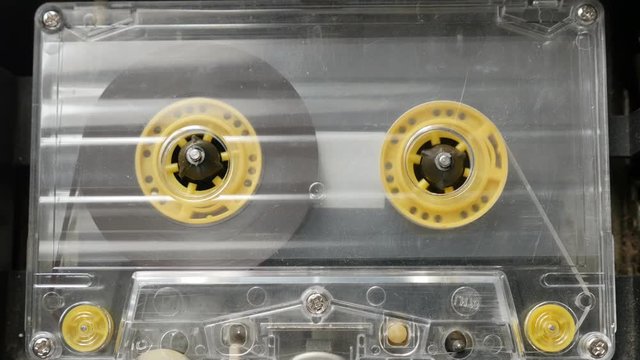 Supply spindle rotation of music player footage - Retro cassette in casettophone close-up 