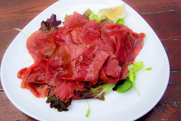 Carpaccio: italian dish of slices of raw beef
