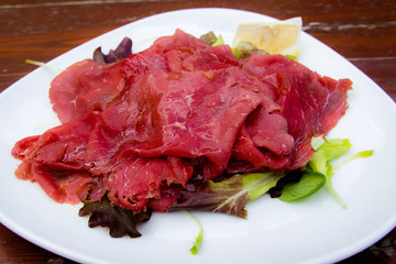 Carpaccio: italian dish of slices of raw beef 