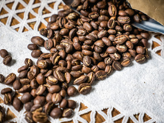 brown craft paper bag with roasted coffee beans