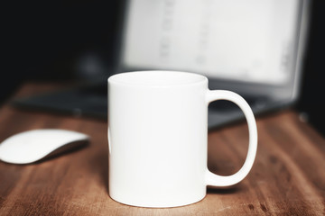 White mug on the desktop