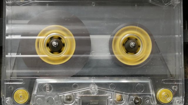  Playing cassette in retro casettophone footage - Supply spindle rotation of music player close-up