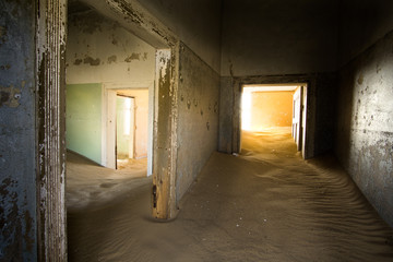 Abandoned house and sand